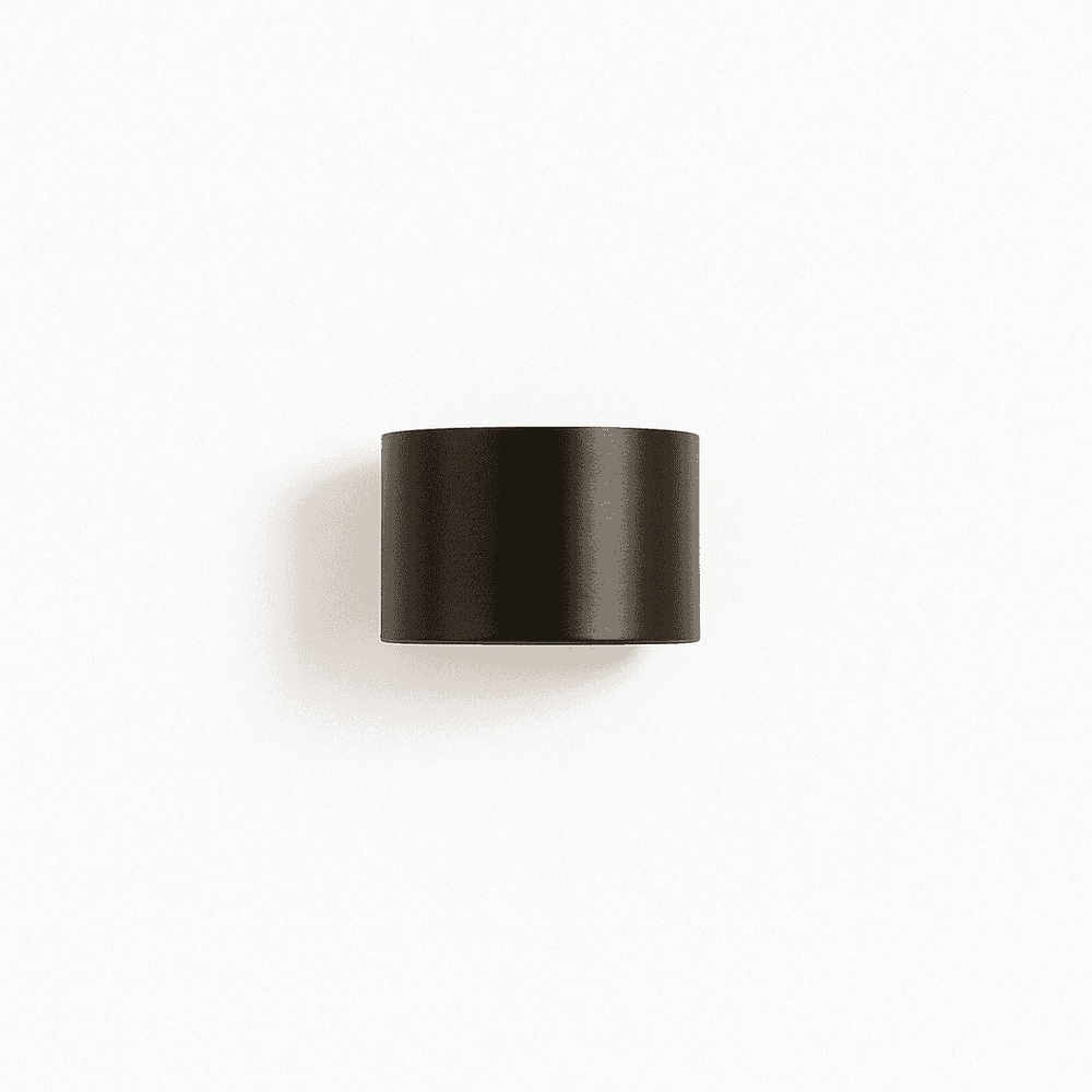 Black cylindrical object on a white background