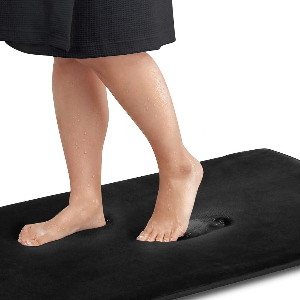 Person standing on a black platform with a white background