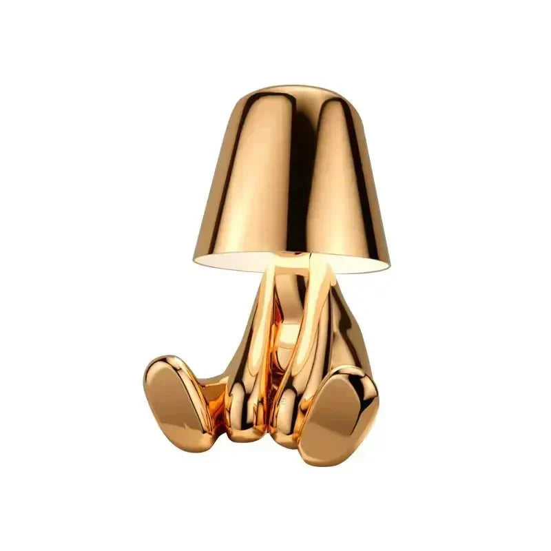 Gold-colored lamp with a unique design on a white background