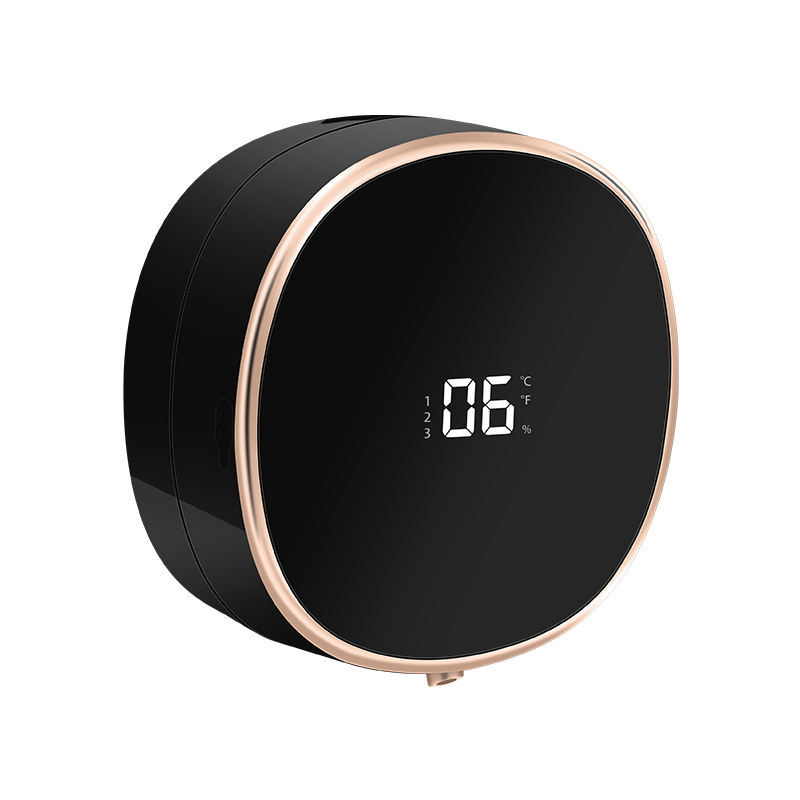 Black and rose gold digital device with a digital display on a white background