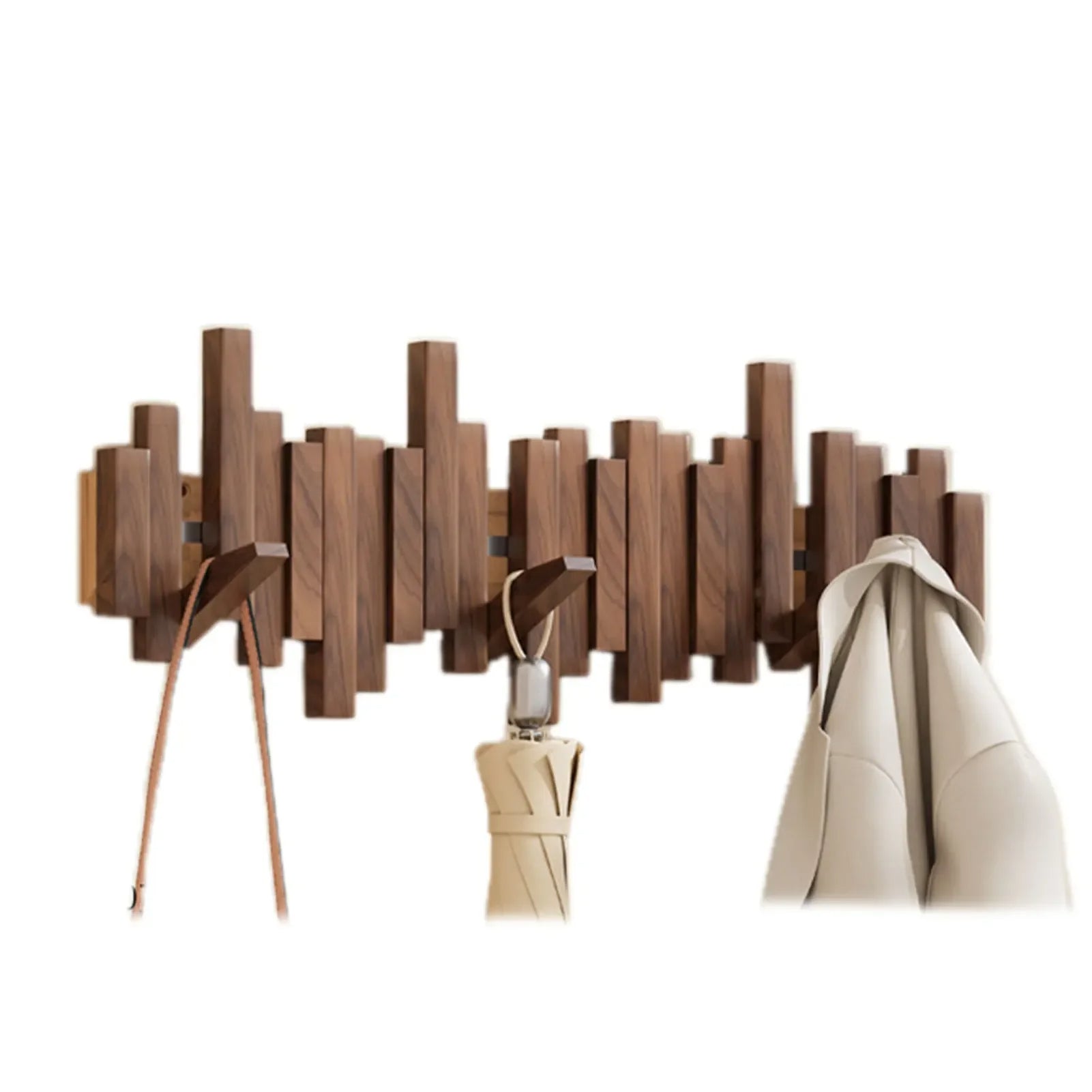 Wooden wall-mounted coat rack with hooks holding a coat, umbrella, and lamp on a white background