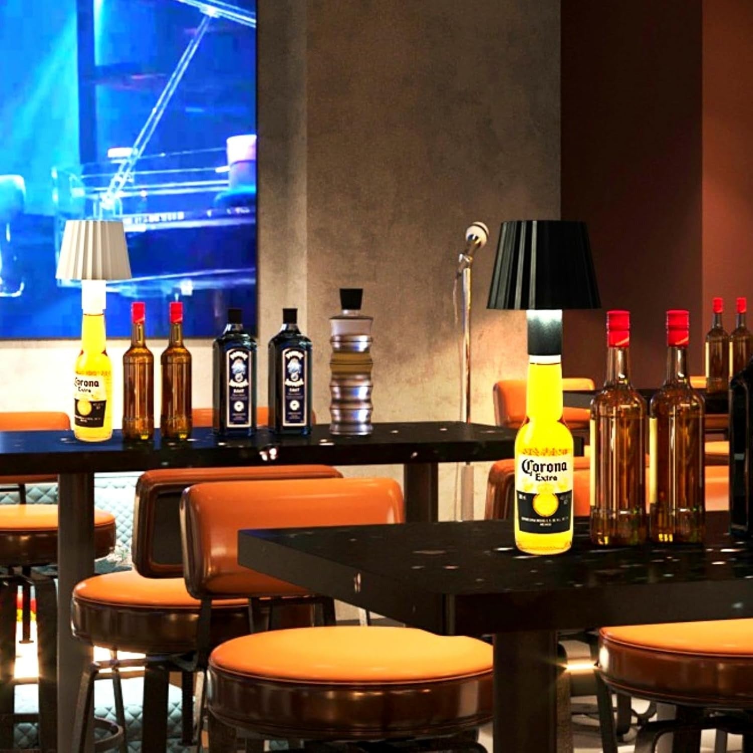 Bar setting with bottles of alcohol on a counter and stools in front.