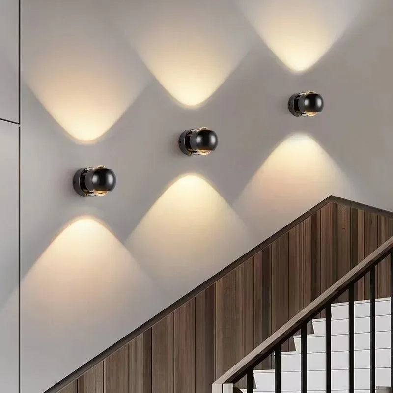 Modern wall lights on a staircase with a neutral color scheme