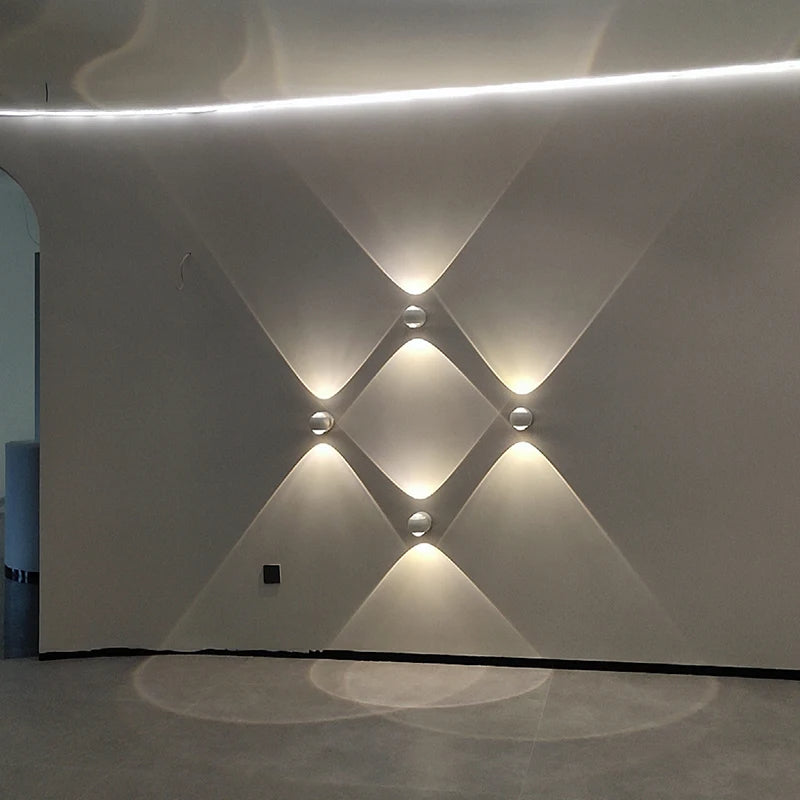 White wall with geometric light patterns