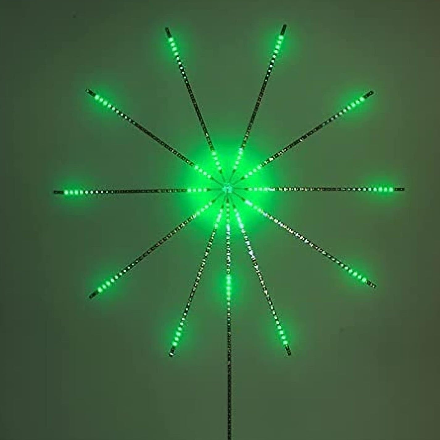 Decorative green light fixture shaped like a star on a white background