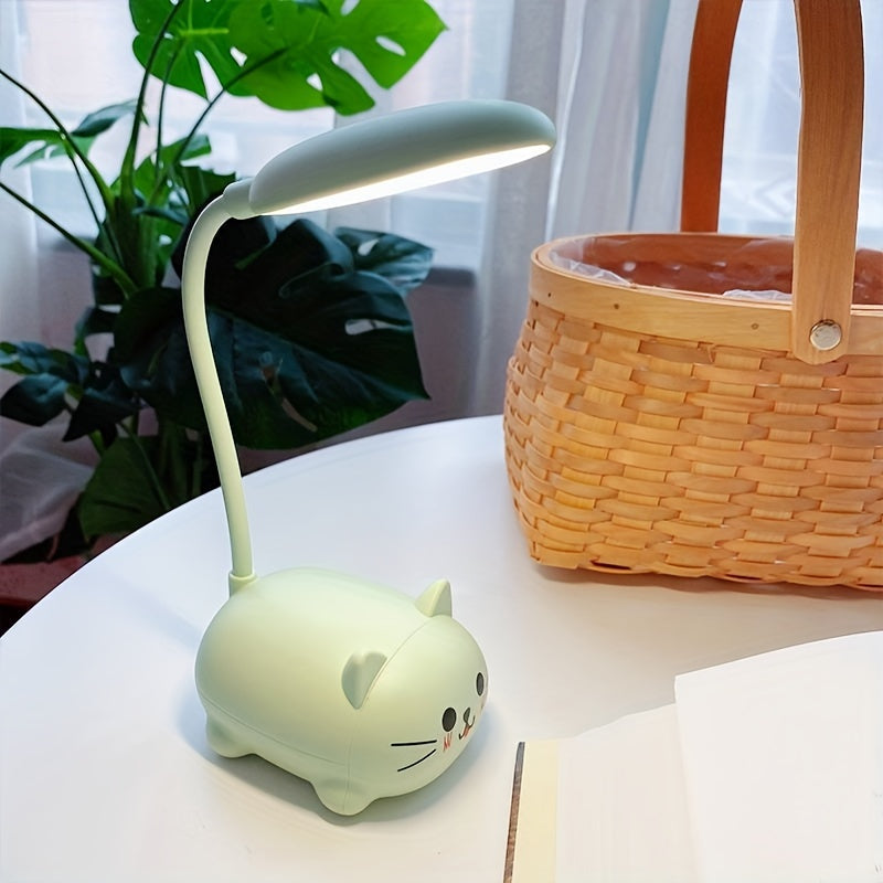 Green cat-shaped desk lamp on a table with a plant and basket in the background