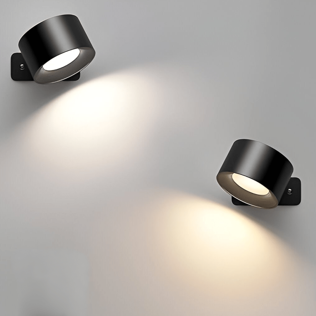 Two black wall-mounted lights on a gray background