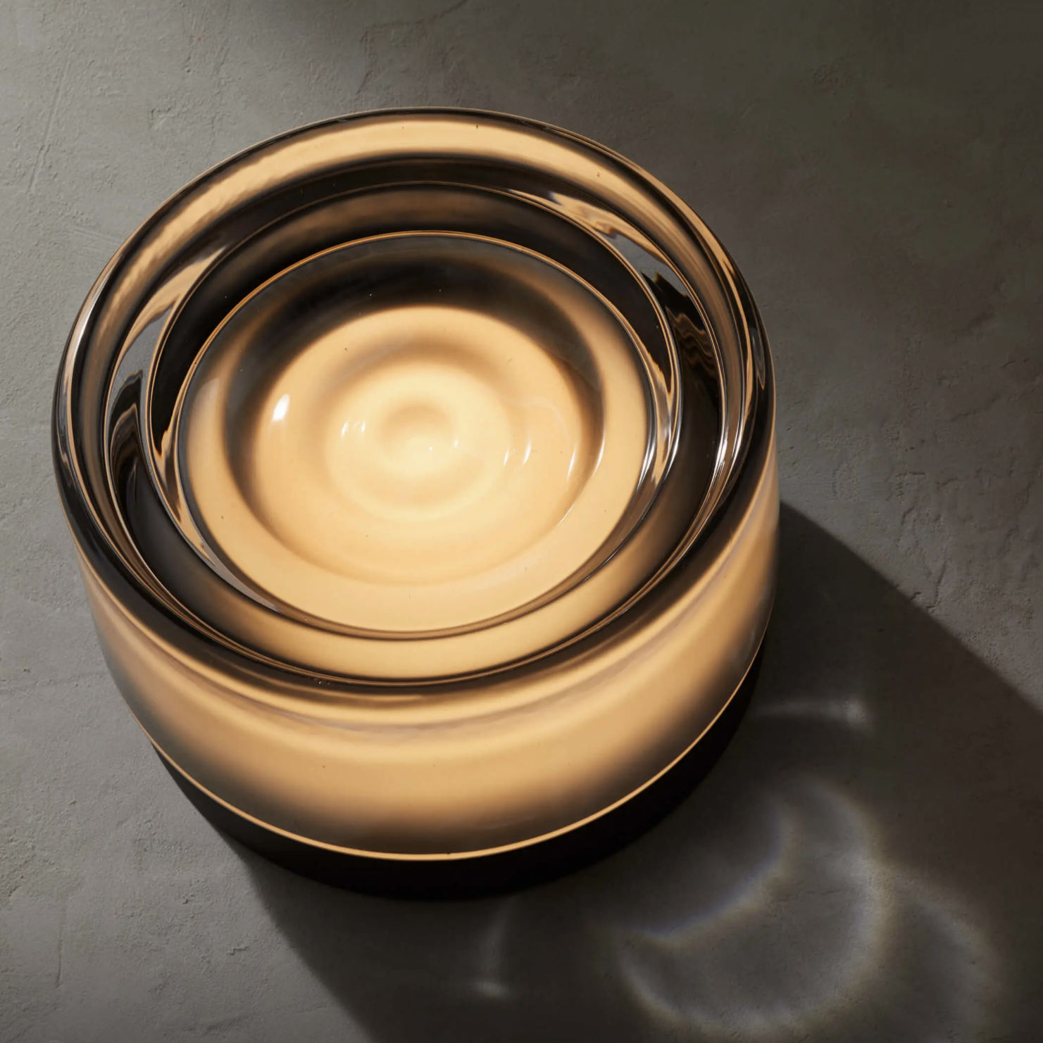 Round wall light fixture on a textured wall