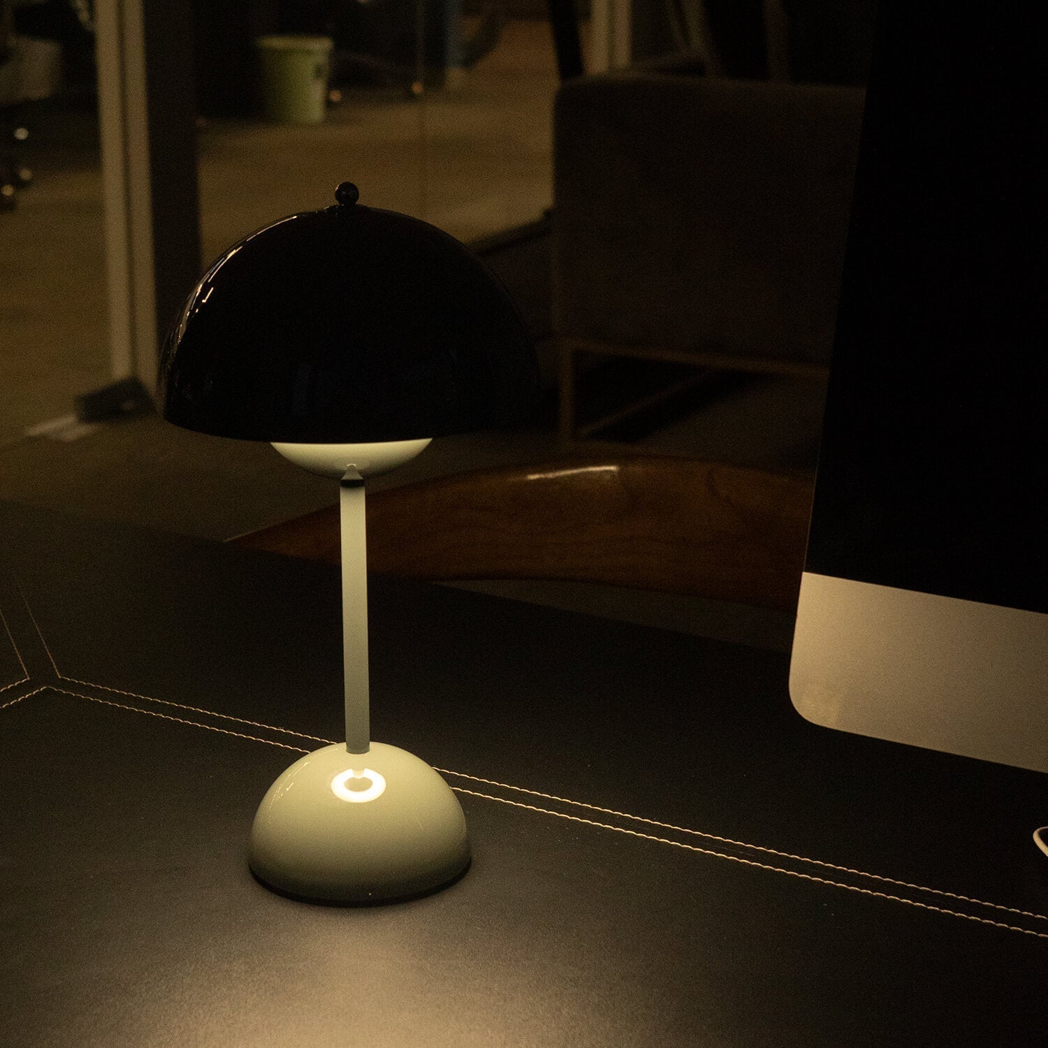 Small lamp on a dark surface with a blurred background