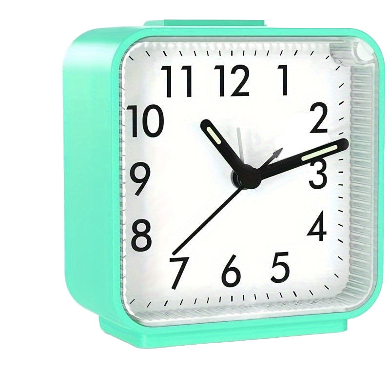 Mint green alarm clock with measurements indicated