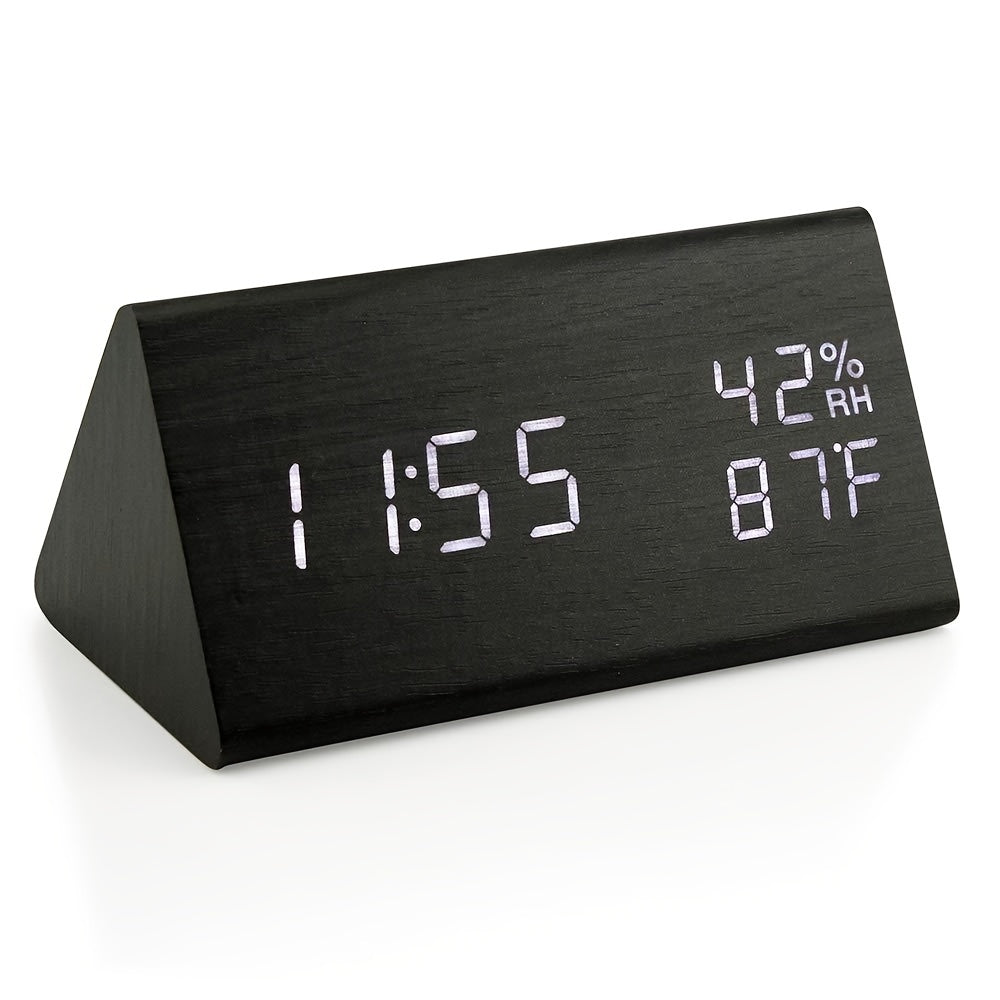 Black digital clock with time, temperature, and humidity display on a white background