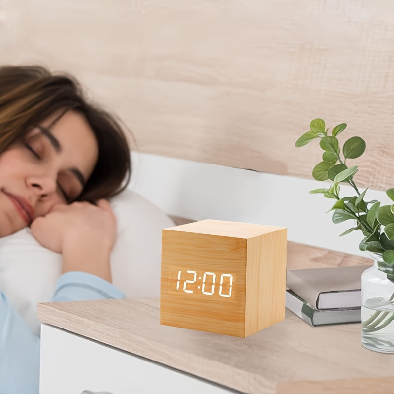 Woman sleeping in bed with a wooden digital clock displaying 12:00 on a nightstand.