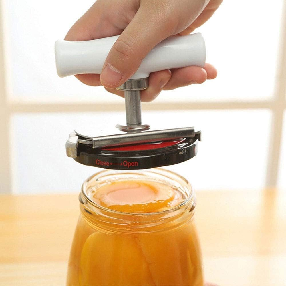 Hand using a jar opener on a glass jar with a blurred background