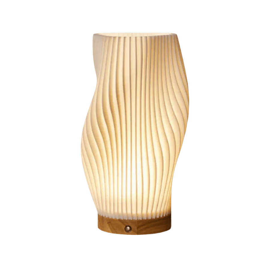 Wooden table lamp with wavy design on a white background