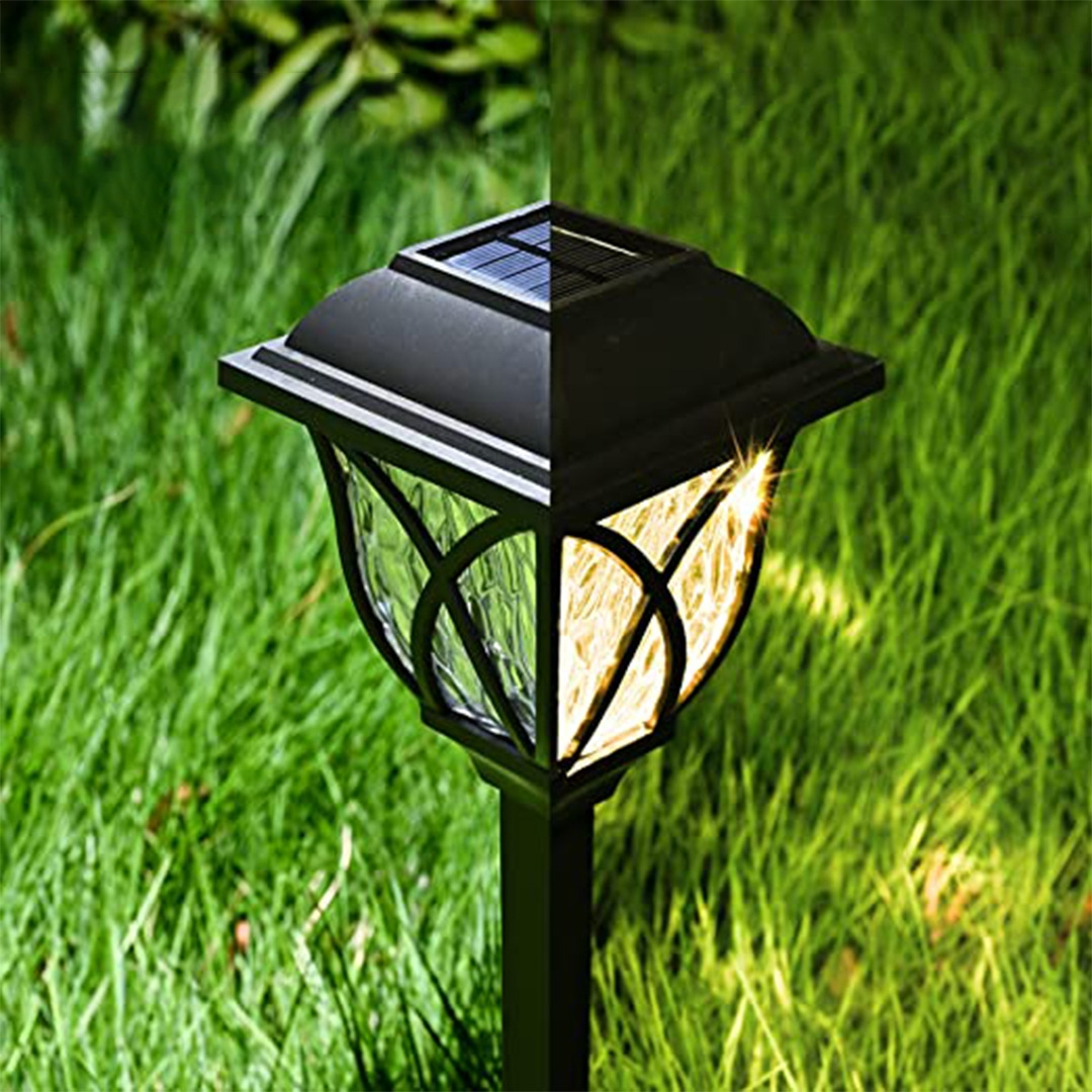 Solar-powered outdoor light fixture on grass