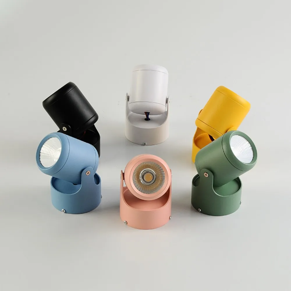 Set of colorful outdoor spotlights on a light gray background