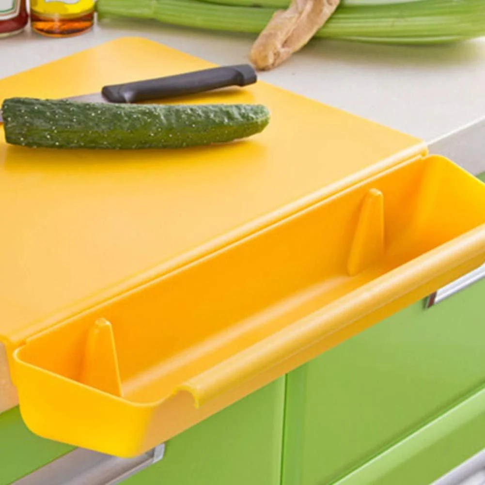 Yellow cutting board with a cucumber on a kitchen counter