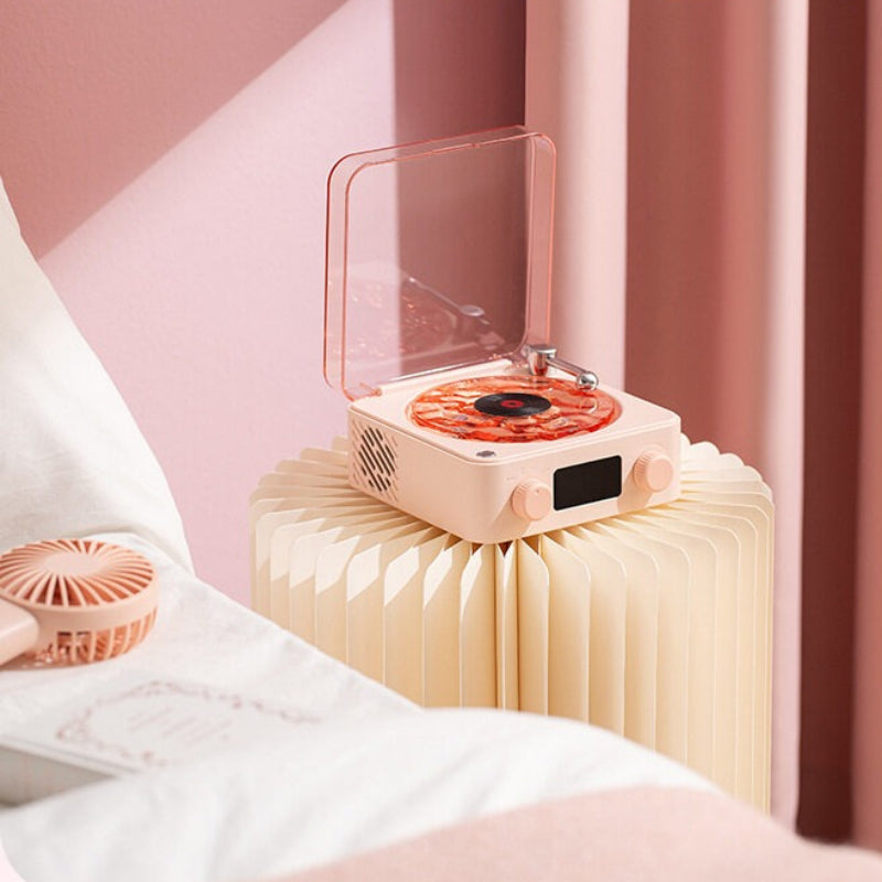 Pink electronic device on a stand with a blurred background