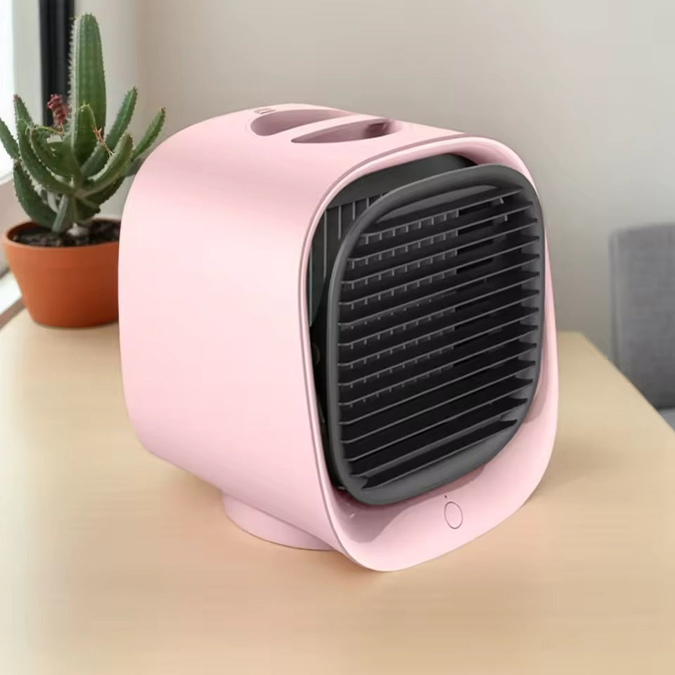 Pink portable fan on a surface with a plant in the background