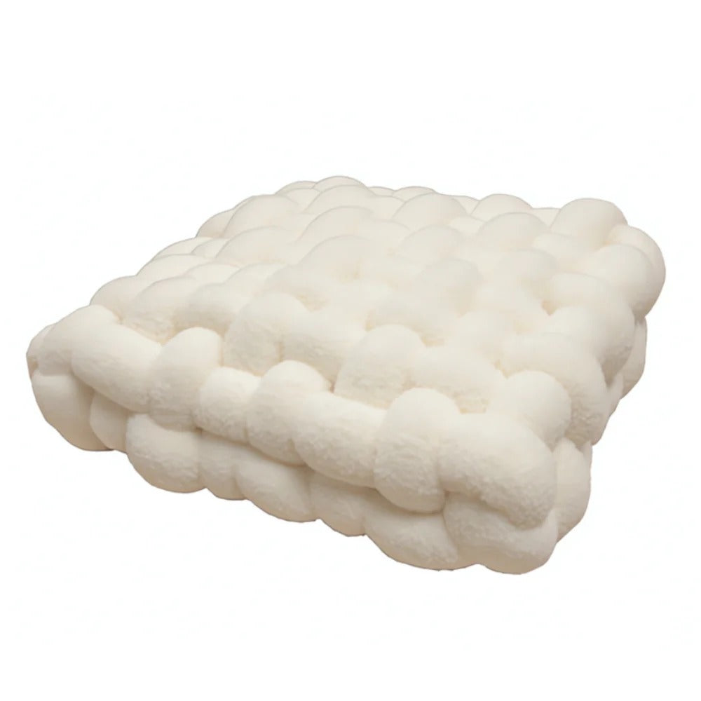 White textured pillow on a white background