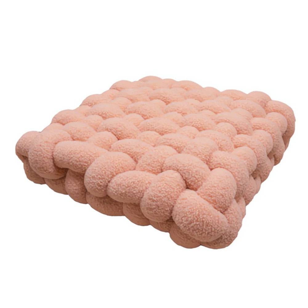 Pink textured blanket on a white background