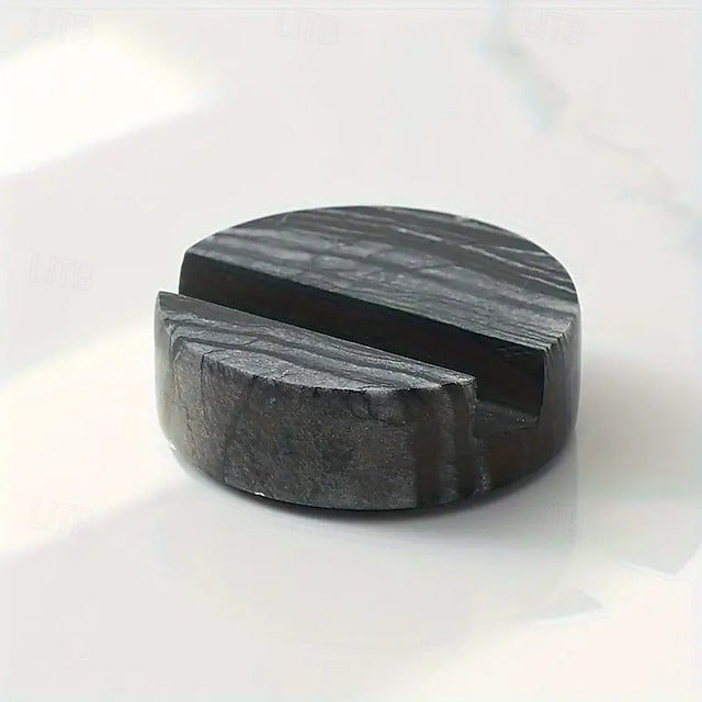 Black stone ring with a unique design on a white background
