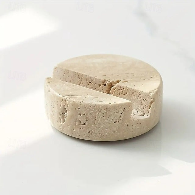 Round block of cheese with a wedge cut out on a white background