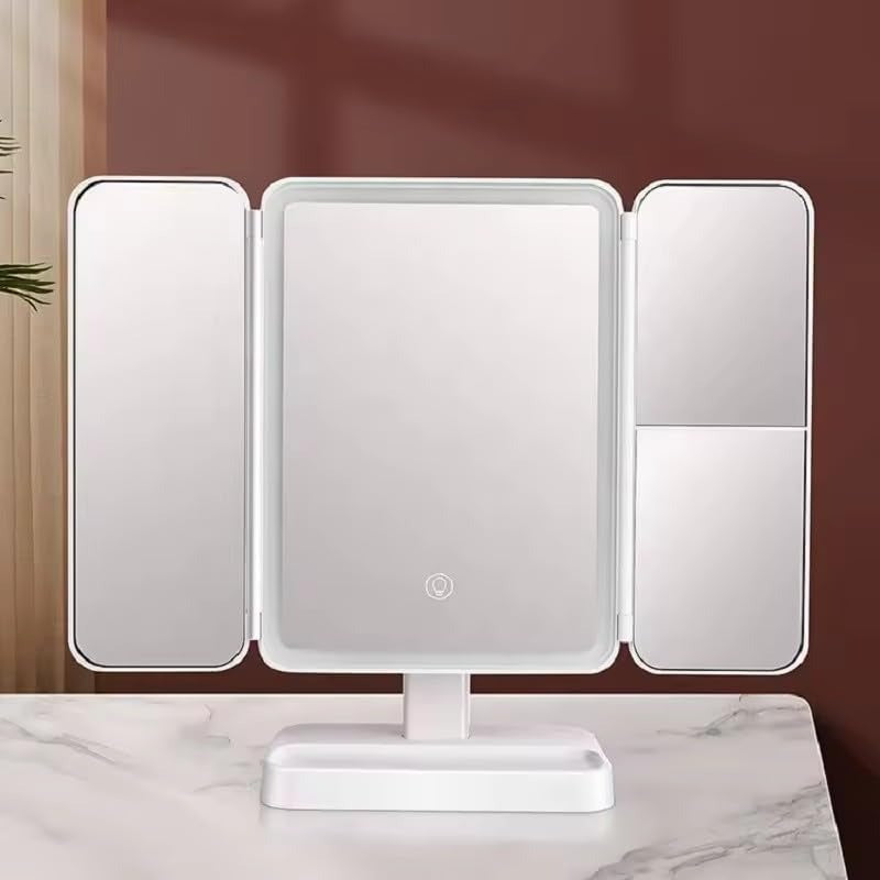 Tri-fold makeup mirror with LED lights on a marble surface.