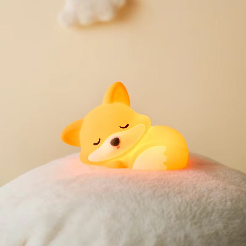 Corgi-shaped night light on a soft surface with a beige background