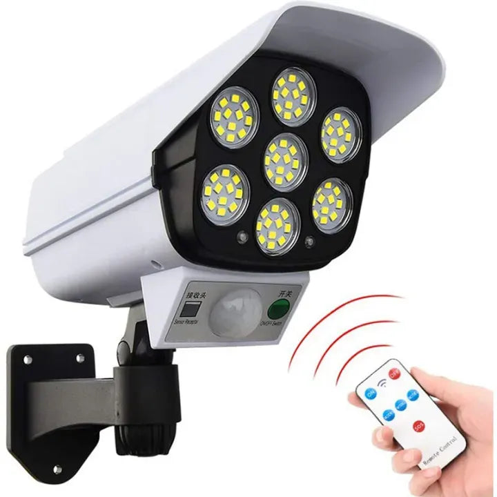 Security camera with LED lights and a remote control on a white background