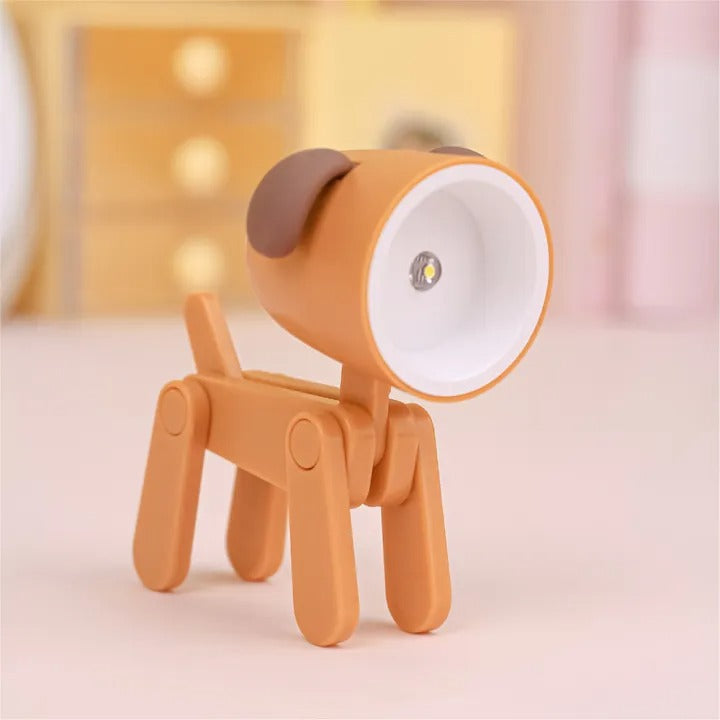 Dog-shaped lamp with a white light bulb on a soft background
