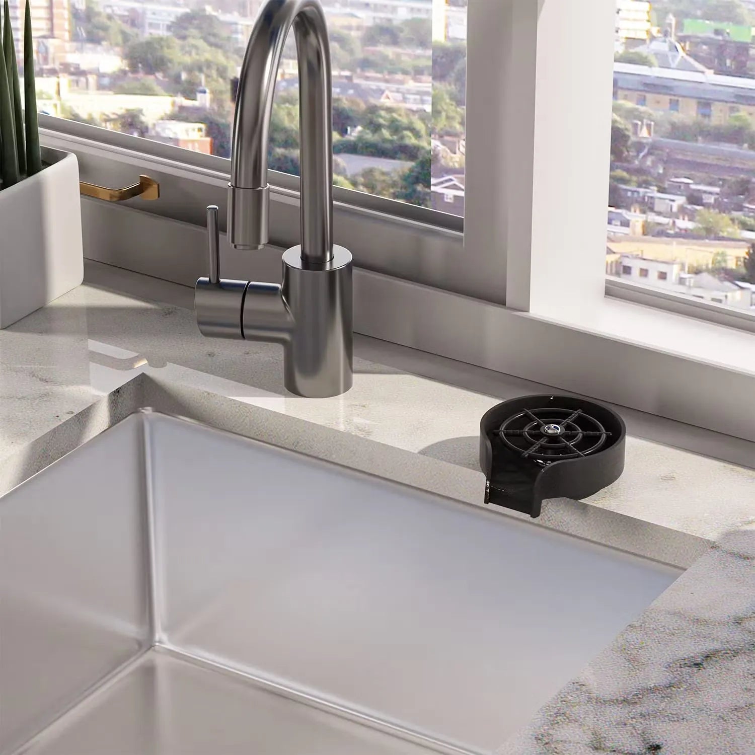 Modern kitchen sink with faucet and black filter against a window backdrop