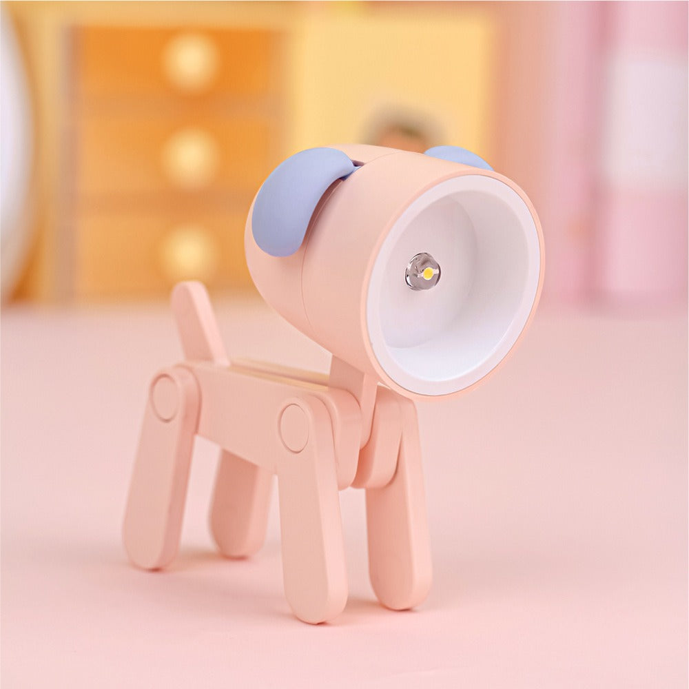 Pink dog-shaped lamp with a white light bulb on a soft pink background