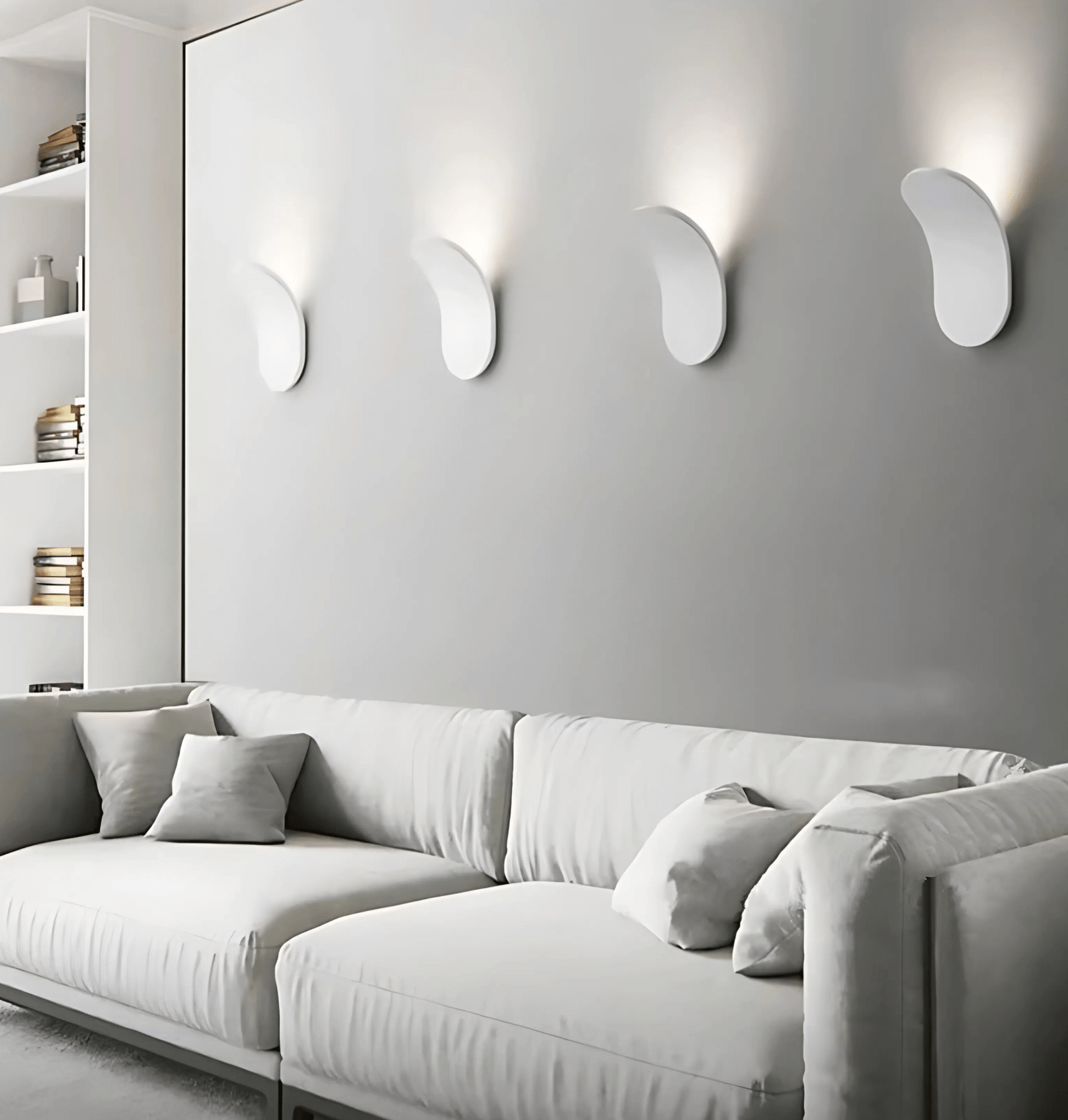 Modern living room with a gray sofa and wall-mounted lights.