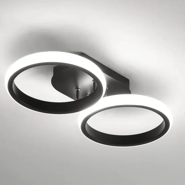 Modern ceiling light fixture with two circular designs on a gray background