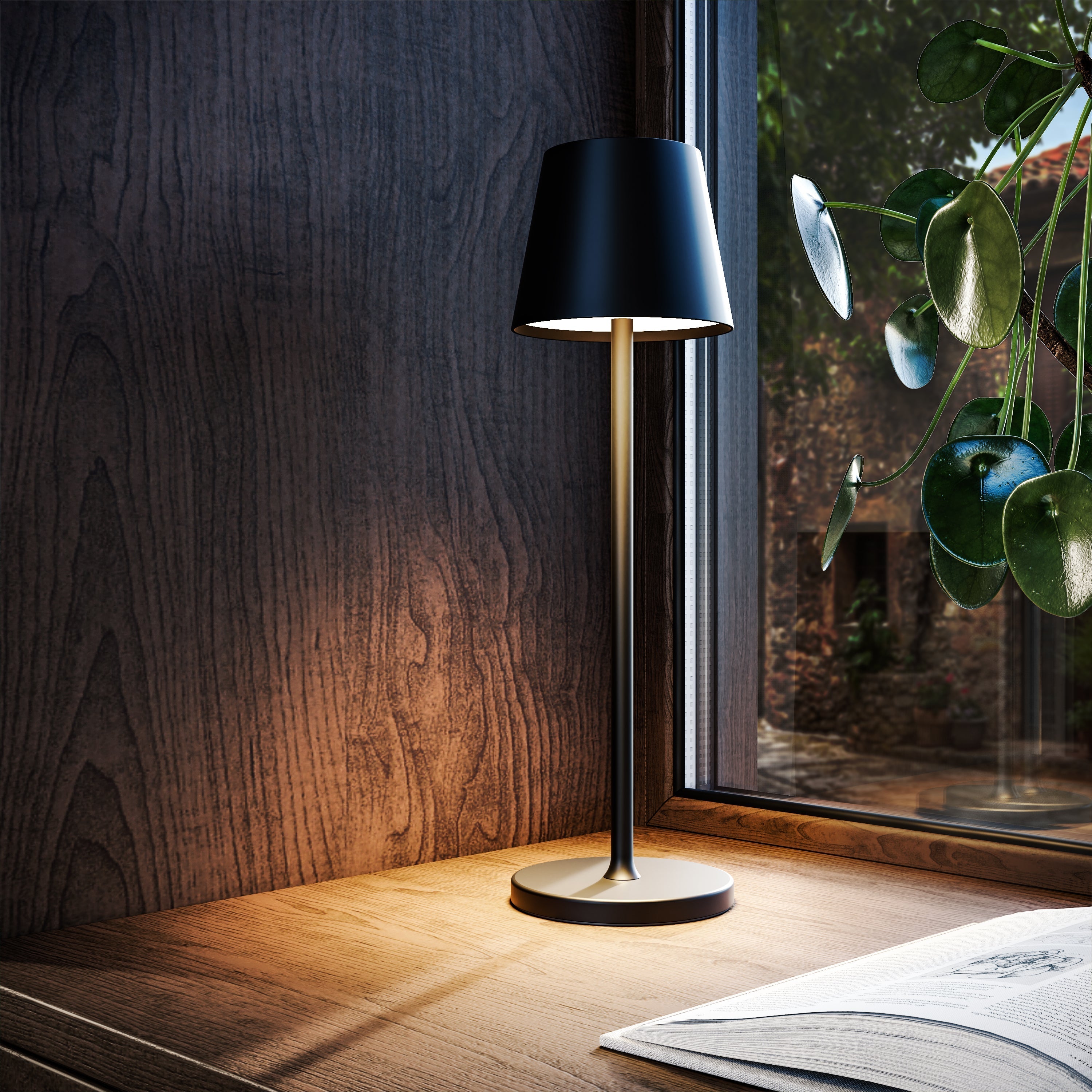 Black table lamp on a wooden surface next to a window with a plant