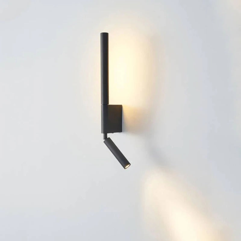 Modern wall-mounted light fixture on a white wall
