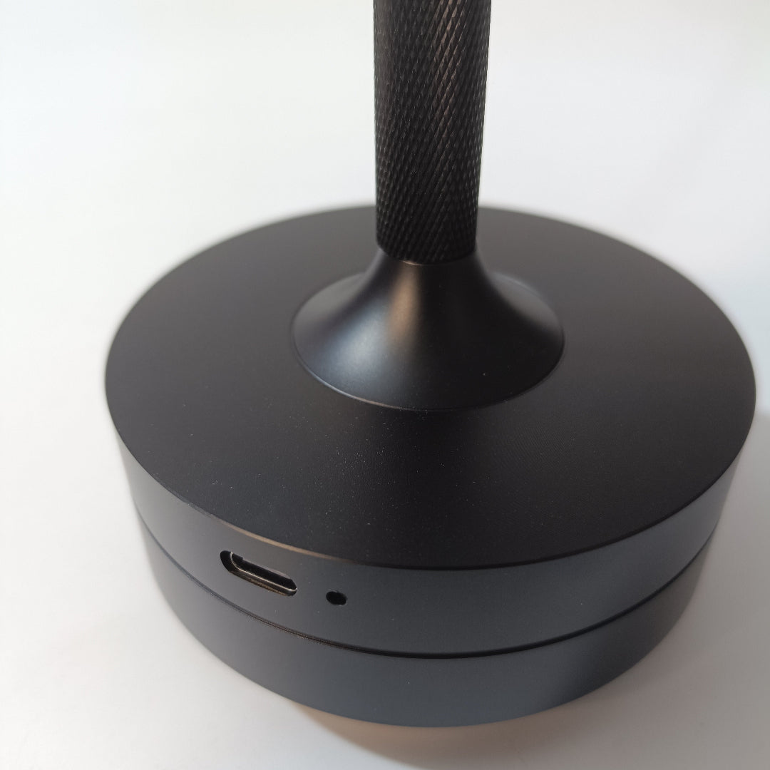 Black stand with USB port on a white background