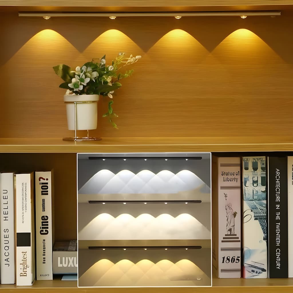 Shelf with books and a potted plant against a wooden wall.