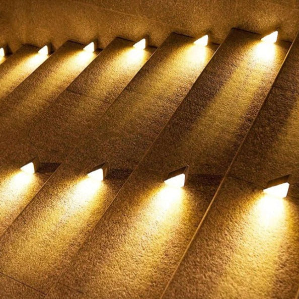 Decorative wall lights embedded in a textured wall