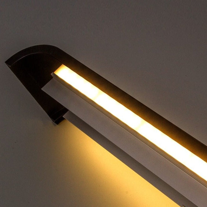 Modern wall-mounted light fixture on a plain background