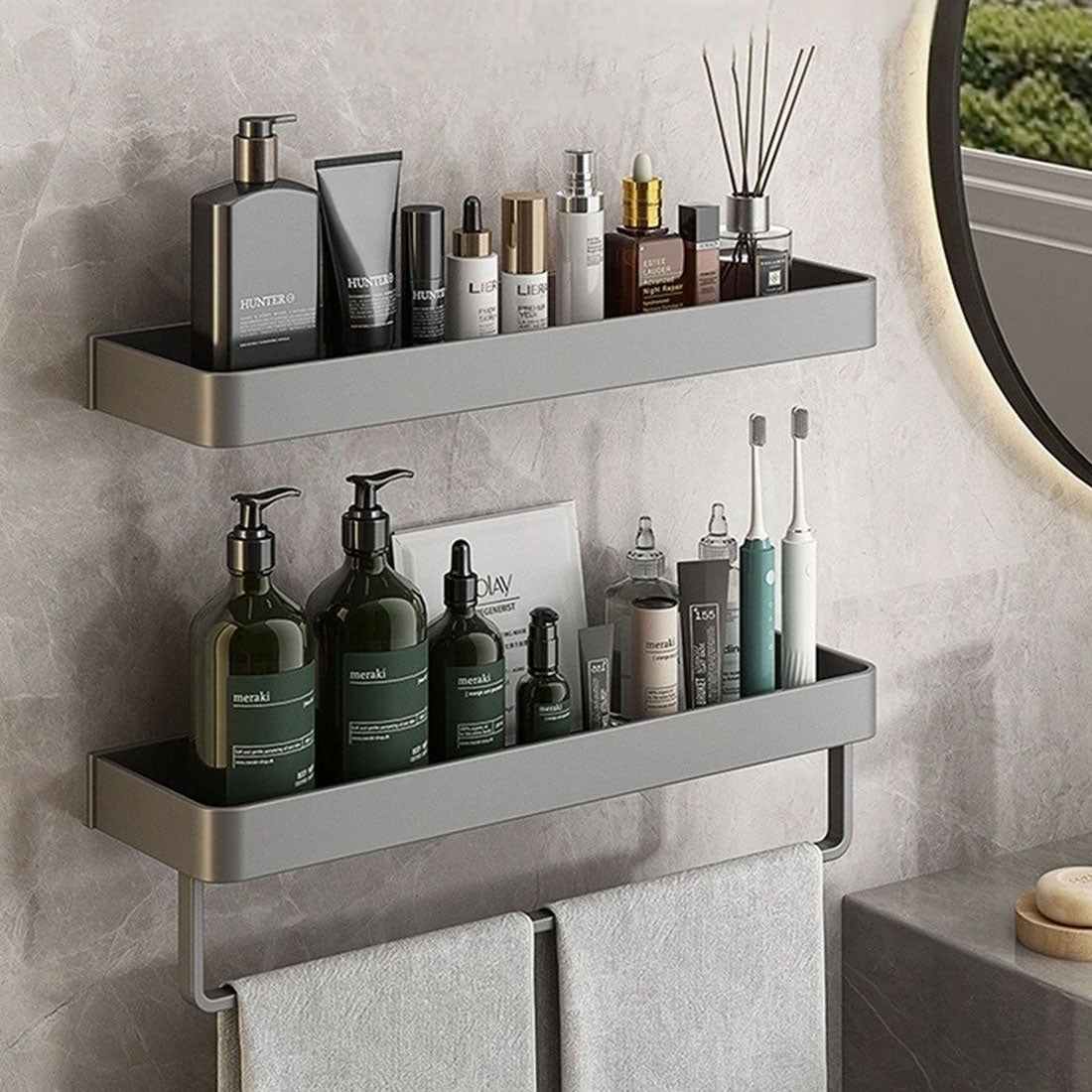 Bathroom shelves with various toiletries against a tiled wall.