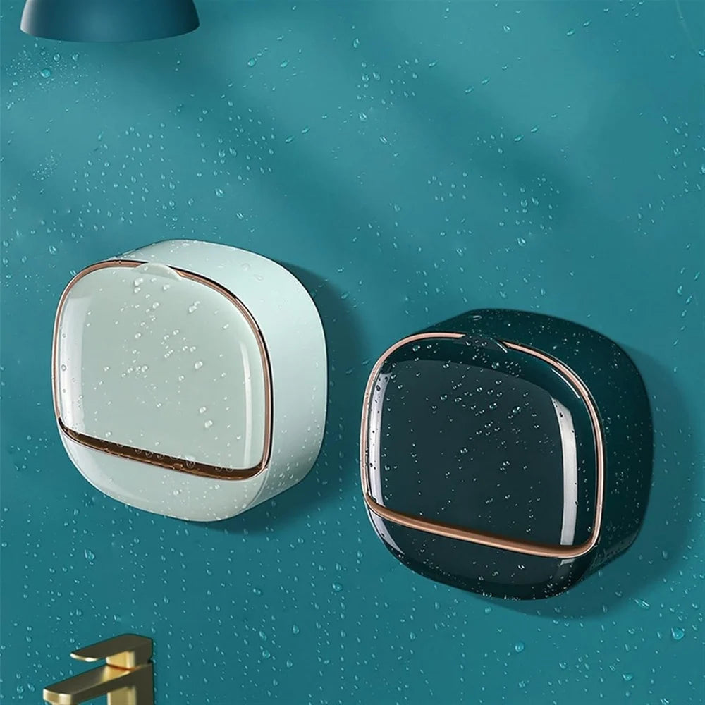 Two decorative wall hooks with gold accents on a teal background