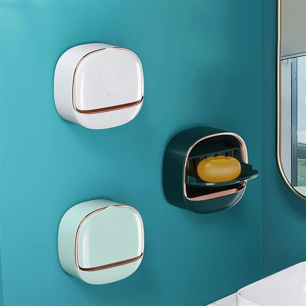Wall-mounted soap dispenser with a bar of soap on a teal wall.