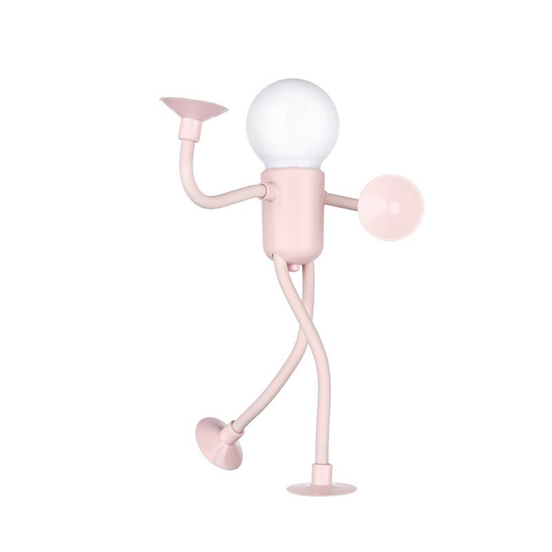 Pink lamp shaped like a person with a light bulb for a head on a white background