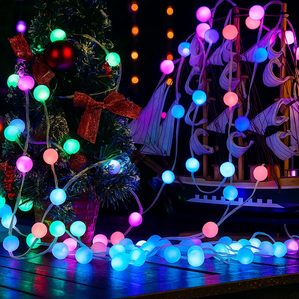 Colorful string lights draped over a Christmas tree and decorative boat on a dark background