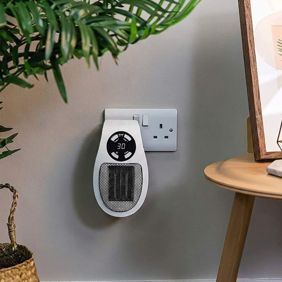 Wall-mounted space heater with digital display in a home setting