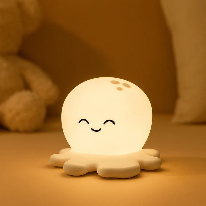 Cute octopus-shaped night light with a smiling face on a warm-toned background