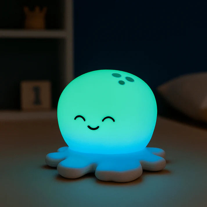 Glowing octopus-shaped night light on a dark background