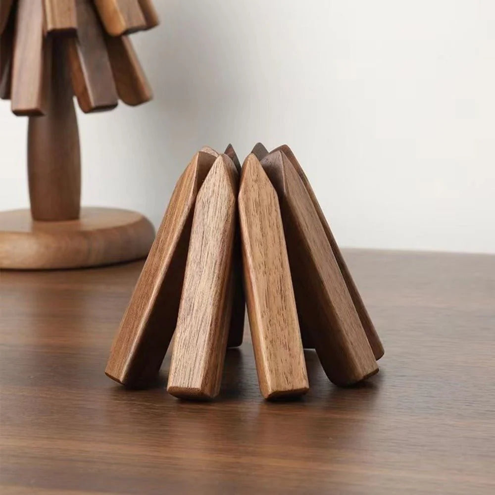 Wooden decorative item resembling a stack of books on a wooden surface